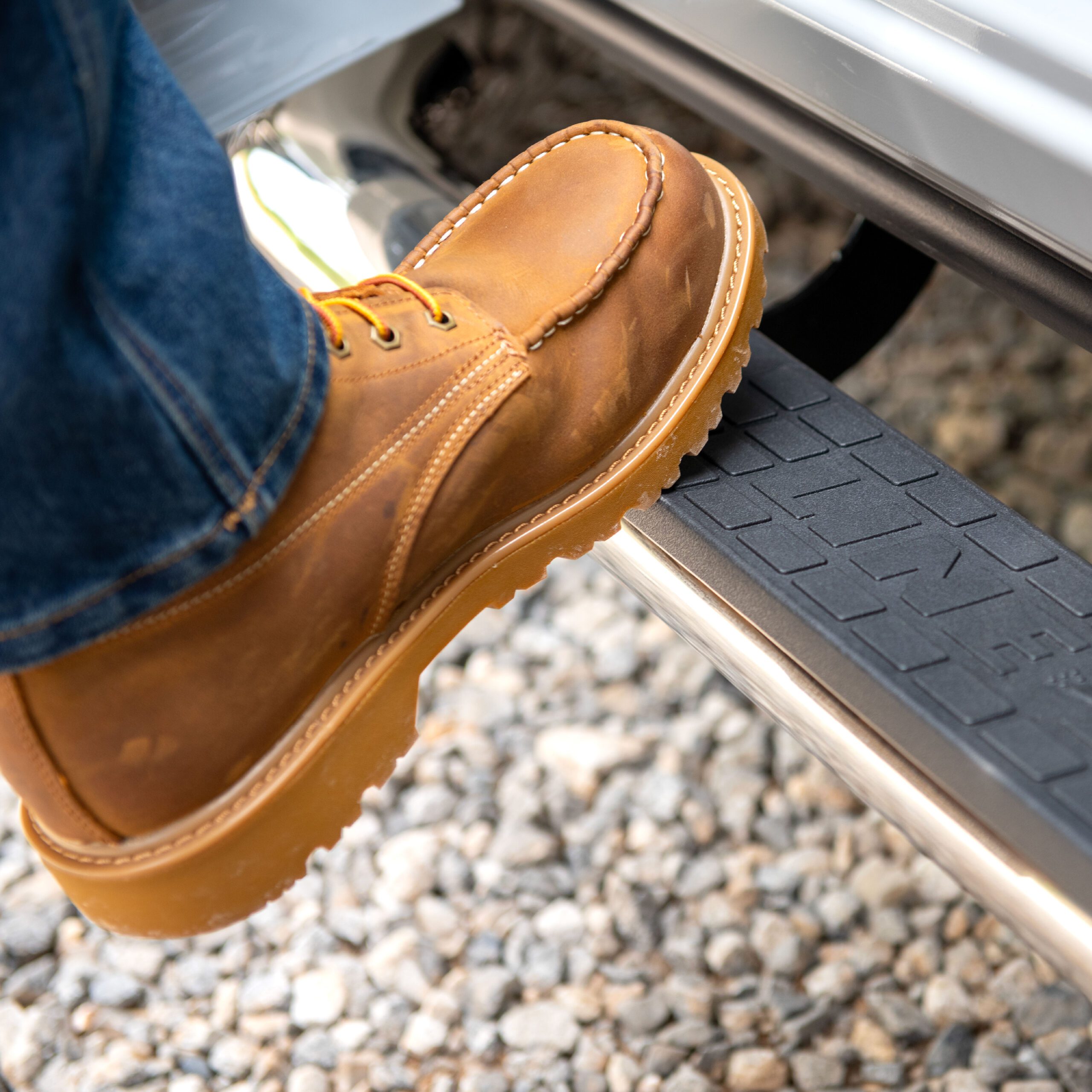 Men stepping onto LINE-X running board into truck